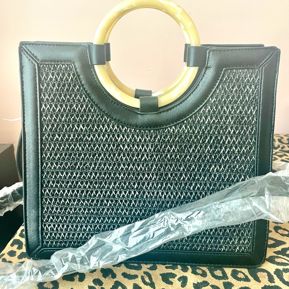 Black Bag w/rattan style front,inside pocket with strap.Smoke free.No pets.